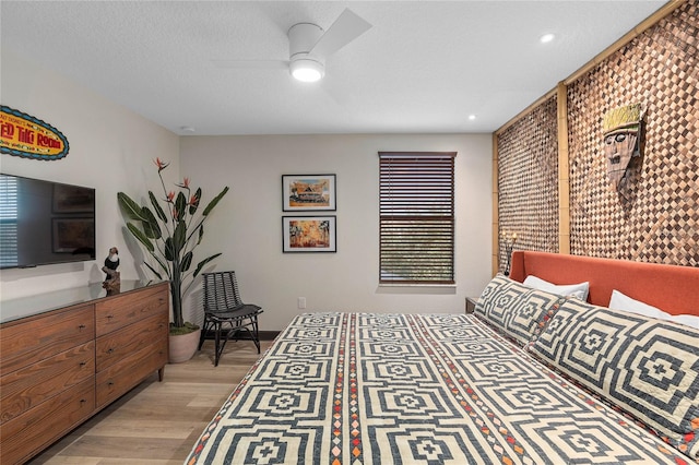 bedroom featuring ceiling fan and light wood-type flooring