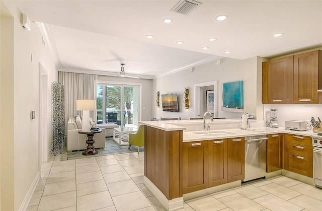 915 Seaside Drive 607, Weeks 14-15, Sarasota, FL 34242 - kitchen featuring stainless steel dishwasher, a peninsula, light countertops, brown cabinets, and ornamental molding