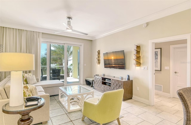 living room with ornamental molding, light tile patterned floors, and ceiling fan