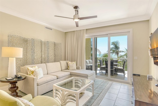 tiled living room with crown molding and ceiling fan