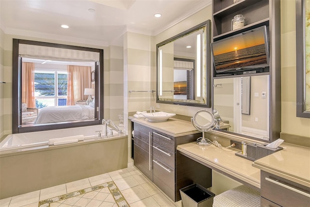 bathroom featuring tile patterned floors, vanity, a washtub, and crown molding