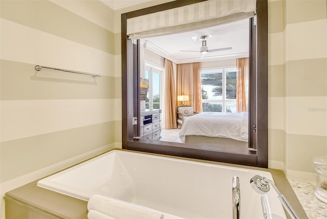 bathroom with a washtub, ceiling fan, and crown molding