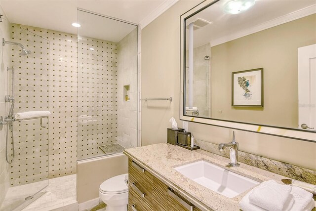 bathroom with vanity, toilet, and ornamental molding