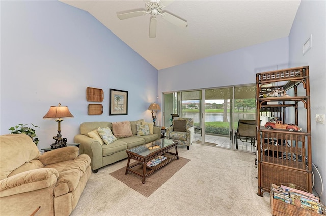 living room with lofted ceiling, light colored carpet, ceiling fan, and a water view