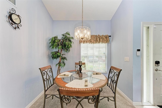 dining room featuring light colored carpet and a notable chandelier