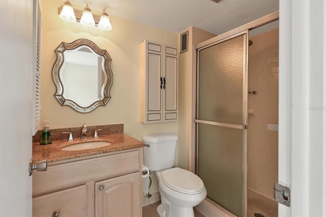 bathroom with walk in shower, tile patterned floors, toilet, and vanity