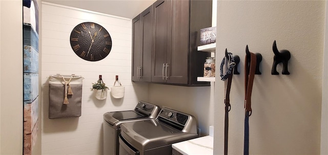 laundry area featuring cabinets and washer and dryer