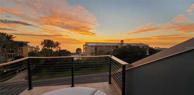 view of balcony at dusk