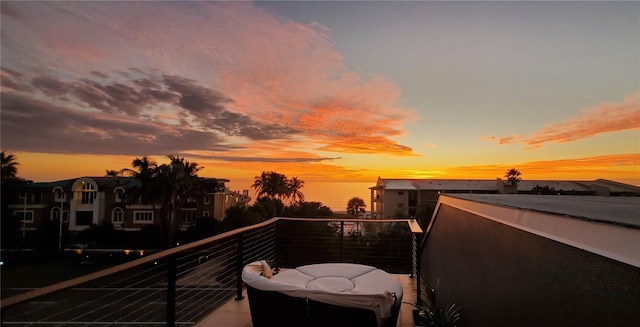 view of balcony at dusk