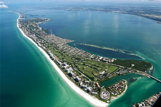 aerial view with a water view and a beach view