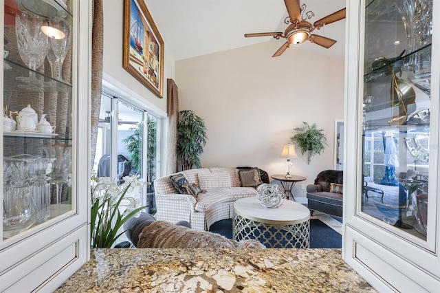 living room with vaulted ceiling and ceiling fan