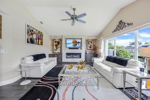 living room with hardwood / wood-style flooring, vaulted ceiling, and ceiling fan