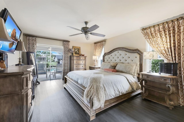 bedroom featuring dark hardwood / wood-style flooring, access to outside, and ceiling fan