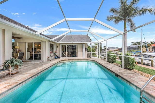 view of pool featuring a patio and glass enclosure