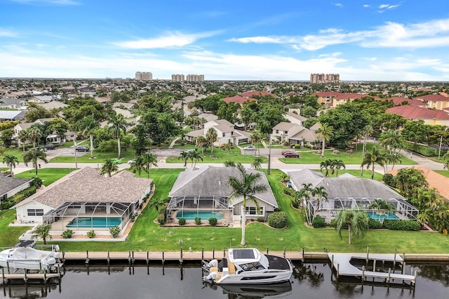 birds eye view of property featuring a water view