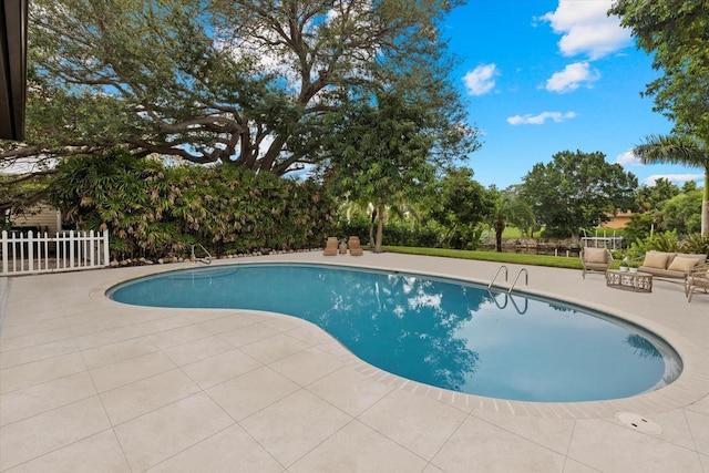 view of pool featuring a patio area