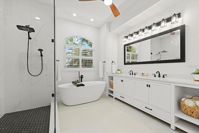 bathroom with plus walk in shower, vanity, and ceiling fan