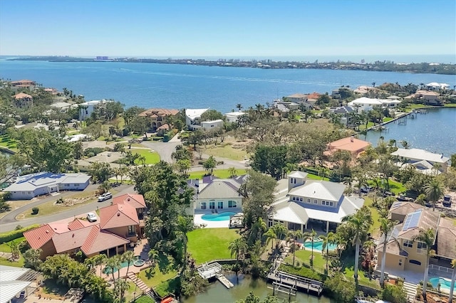 birds eye view of property featuring a residential view and a water view