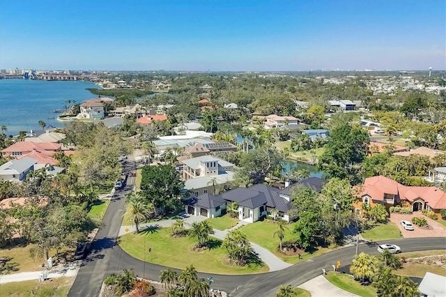 drone / aerial view featuring a residential view and a water view