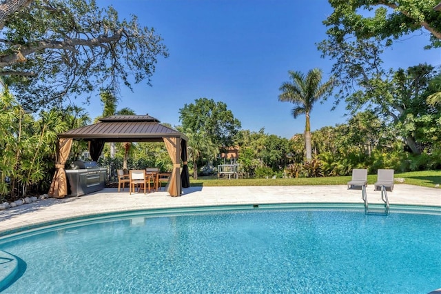 pool featuring a gazebo, area for grilling, a grill, and a patio area