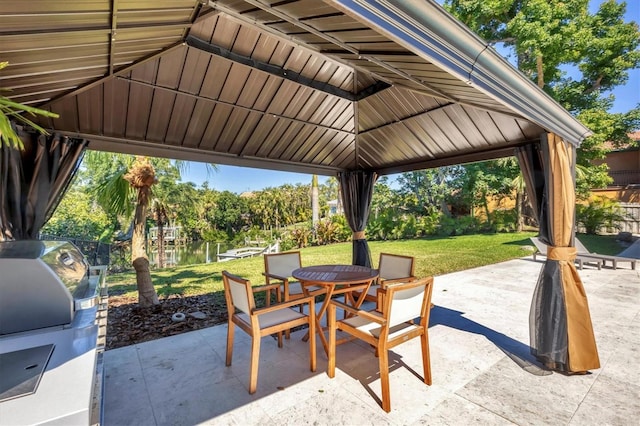 view of patio / terrace with outdoor dining space, a gazebo, area for grilling, and fence