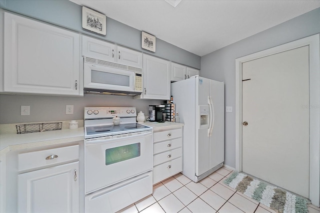 kitchen with white cabinetry, white appliances, and light tile patterned flooring