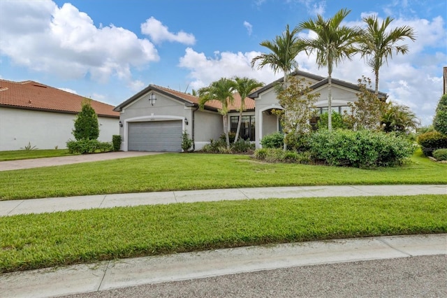 ranch-style house featuring a front lawn and a garage