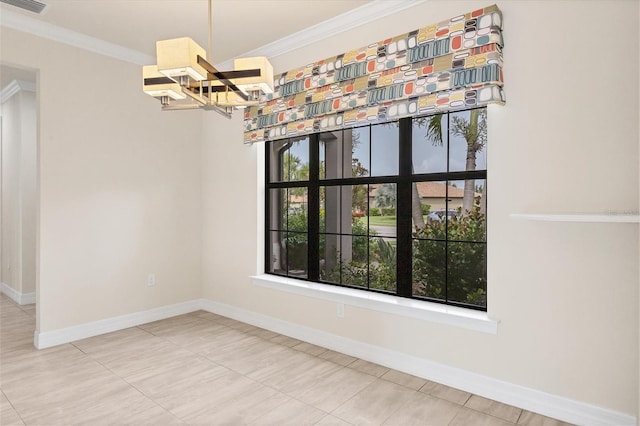 empty room featuring a chandelier, tile patterned flooring, and ornamental molding