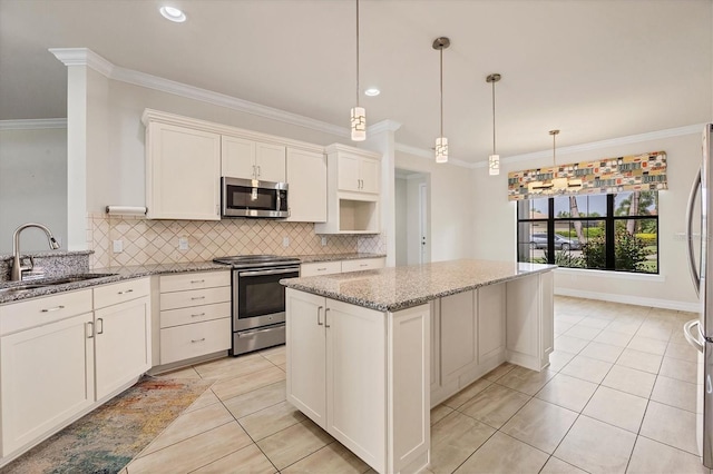 kitchen with light stone countertops, sink, a center island, hanging light fixtures, and stainless steel appliances