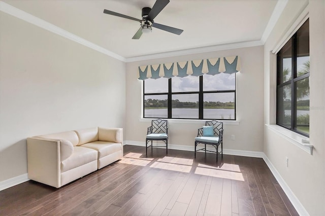 unfurnished room featuring hardwood / wood-style floors, ceiling fan, and crown molding