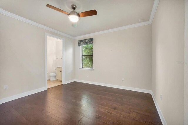 unfurnished room featuring dark hardwood / wood-style floors, ceiling fan, and ornamental molding