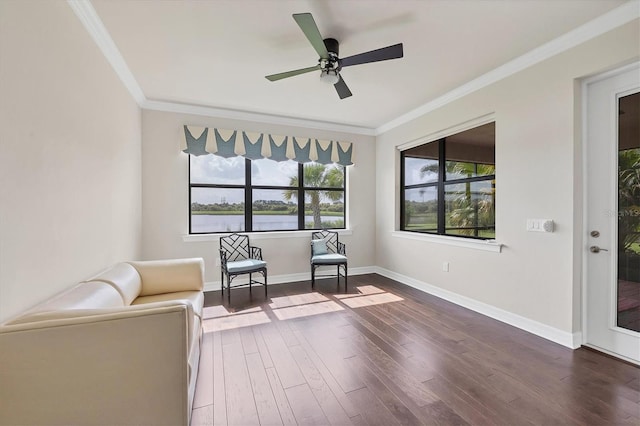 unfurnished room with crown molding, ceiling fan, and dark wood-type flooring