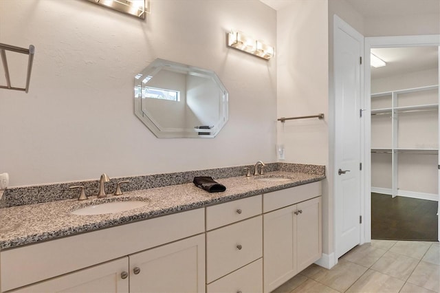 bathroom with tile patterned flooring and vanity