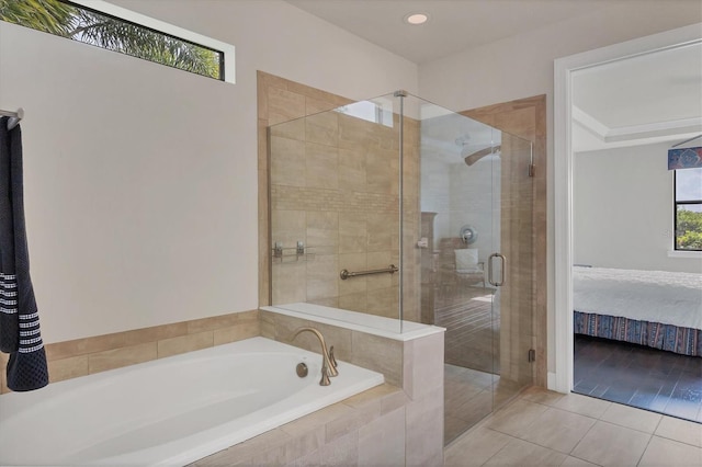 bathroom featuring tile patterned flooring and independent shower and bath