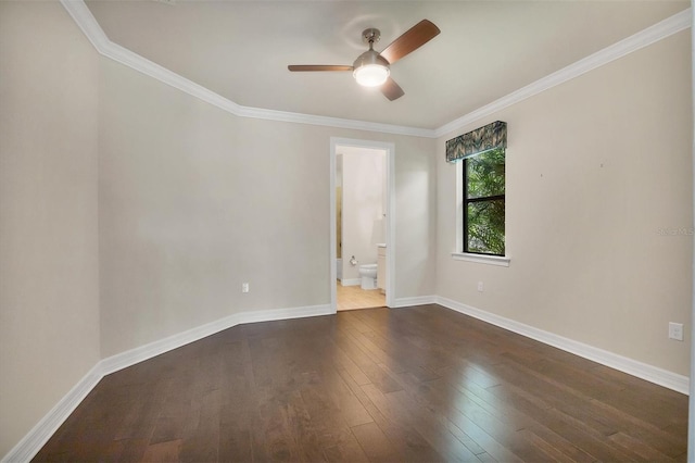 spare room featuring ceiling fan, dark hardwood / wood-style flooring, and crown molding