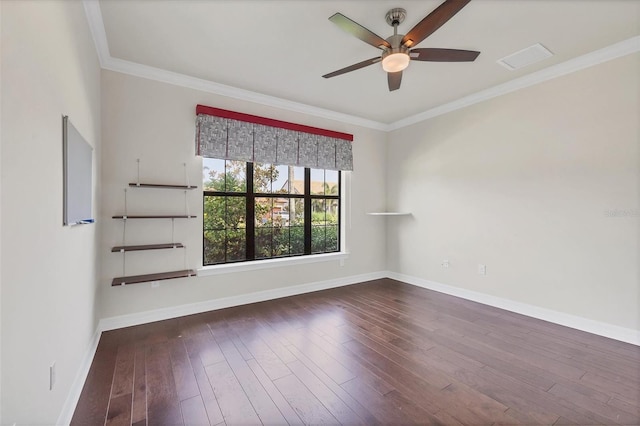 empty room featuring ceiling fan, wood-type flooring, and ornamental molding