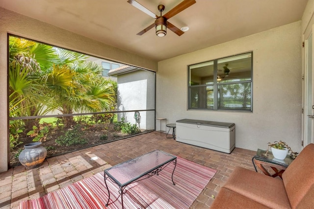 sunroom / solarium with ceiling fan