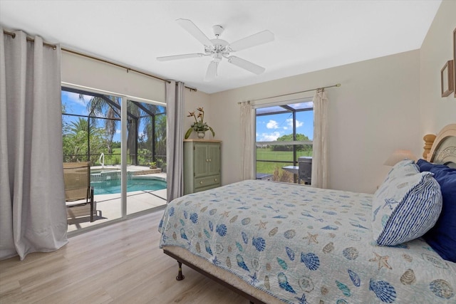 bedroom featuring access to exterior, ceiling fan, and hardwood / wood-style floors