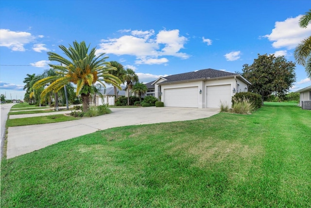 ranch-style house with a garage and a front lawn