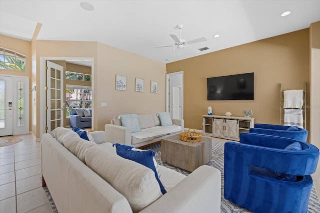 living room with ceiling fan, a healthy amount of sunlight, and light tile patterned floors