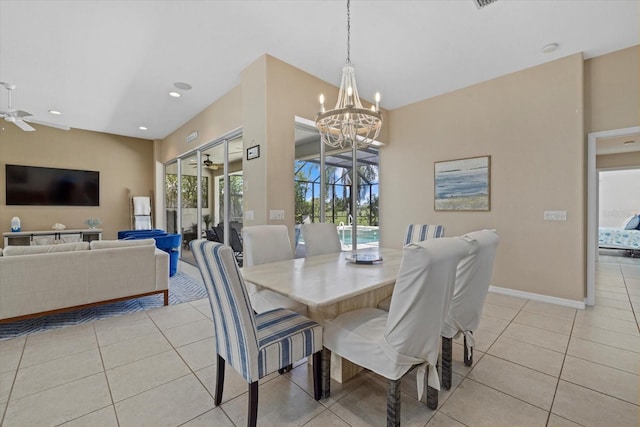 dining room with ceiling fan with notable chandelier and light tile patterned floors