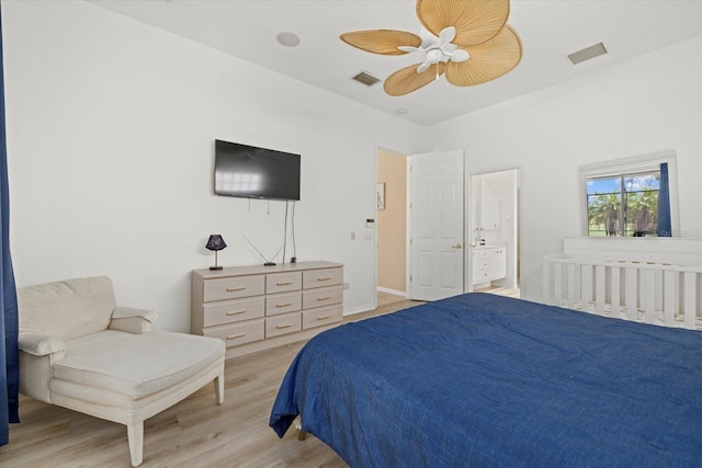 bedroom featuring light wood-type flooring, ceiling fan, and ensuite bathroom