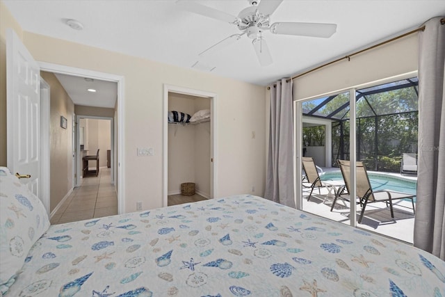 bedroom with a walk in closet, access to exterior, a closet, ceiling fan, and light tile patterned floors