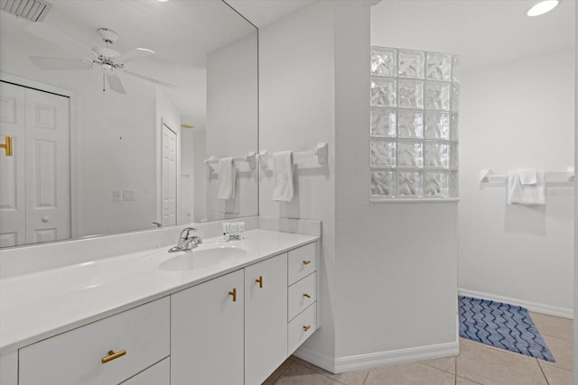 bathroom featuring tile patterned flooring, ceiling fan, and vanity