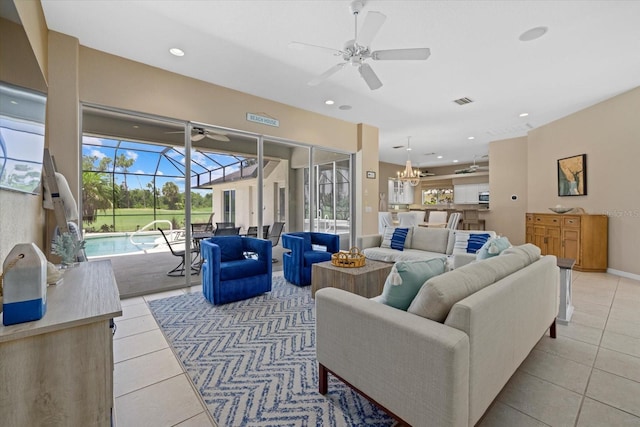 living room featuring light tile patterned floors, baseboards, a sunroom, ceiling fan, and recessed lighting