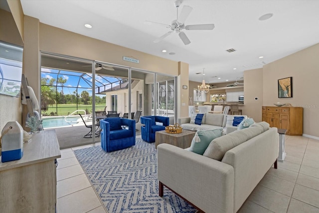 living room with recessed lighting, light tile patterned floors, a sunroom, and ceiling fan