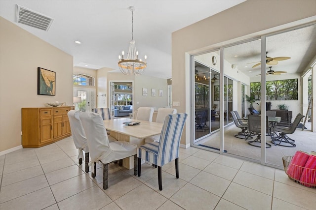 dining room featuring a wealth of natural light, visible vents, ceiling fan with notable chandelier, and light tile patterned flooring
