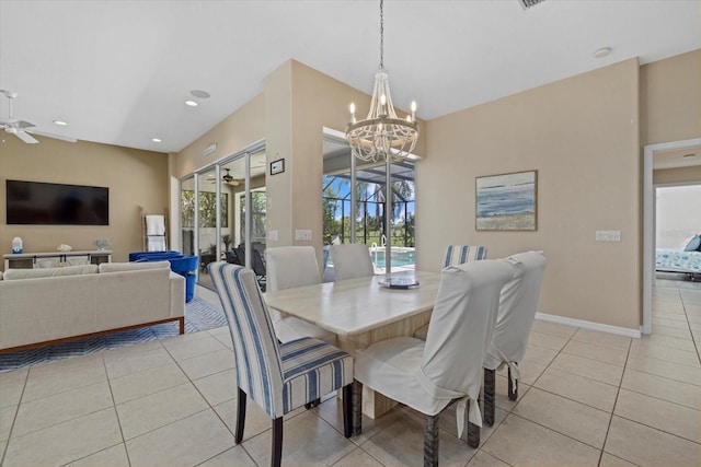 dining room featuring light tile patterned floors, plenty of natural light, and ceiling fan with notable chandelier