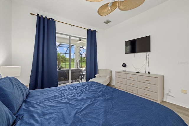 bedroom with visible vents, baseboards, a ceiling fan, wood finished floors, and access to exterior