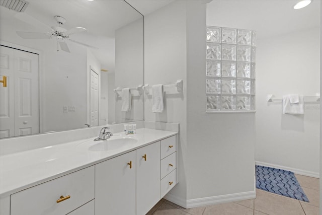bathroom with vanity, baseboards, tile patterned floors, a ceiling fan, and visible vents